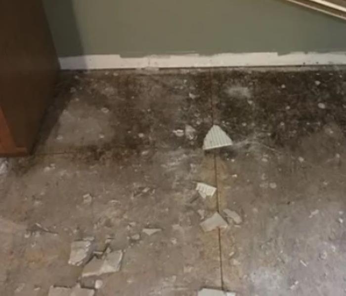 The floor of a storm damaged home is shown 